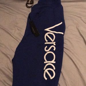 Royal blue Versace sweats ya dig size M